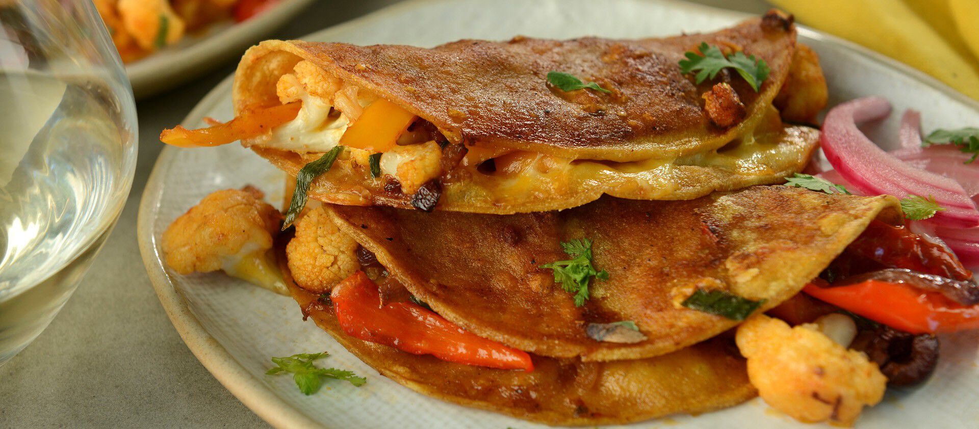 Crispy Cauliflower Tacos with Avocado Crema and Pickled Onions